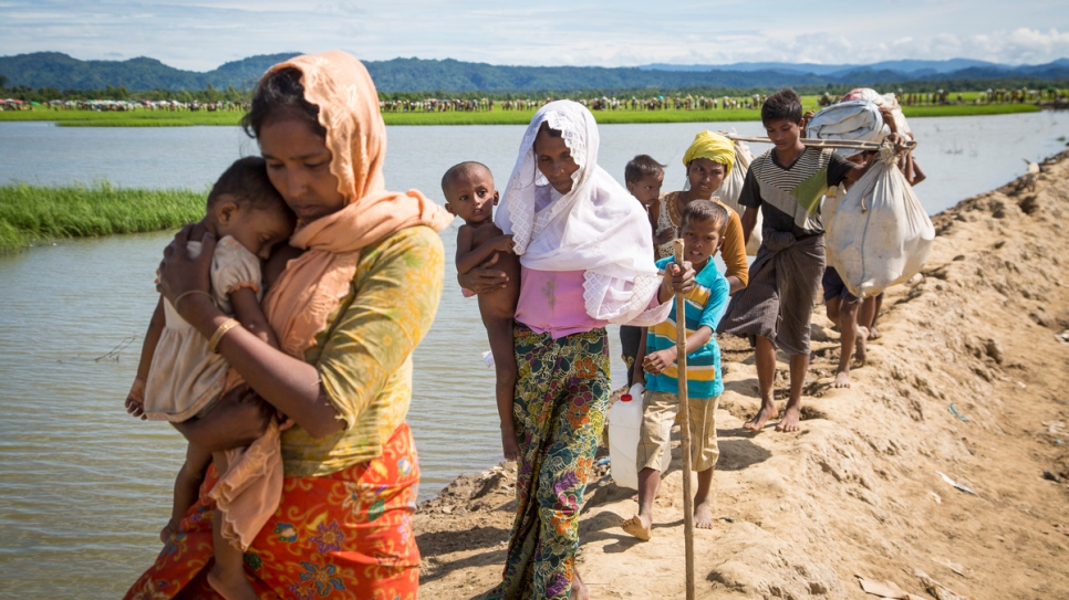 Rohingya families arrive at a UNHCR transit center near the village of Anjuman Para, Cox's Bazar.