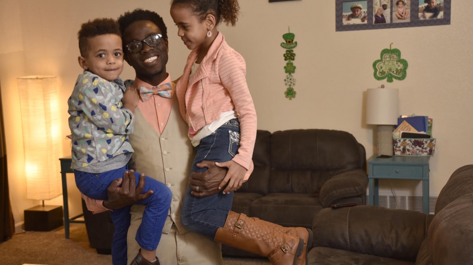 Bertine Bahige, 38, and his two children in their home in Gillette, Wyoming getting ready for the school day.