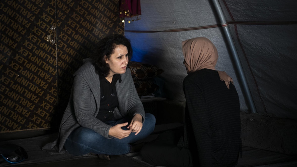 Gynaecologist Nagham Nawzat Hasan visits a Yazidi woman who survived ISIS violence, at a settlement in Duhok Governorate in the Kurdistan region of northern Iraq.