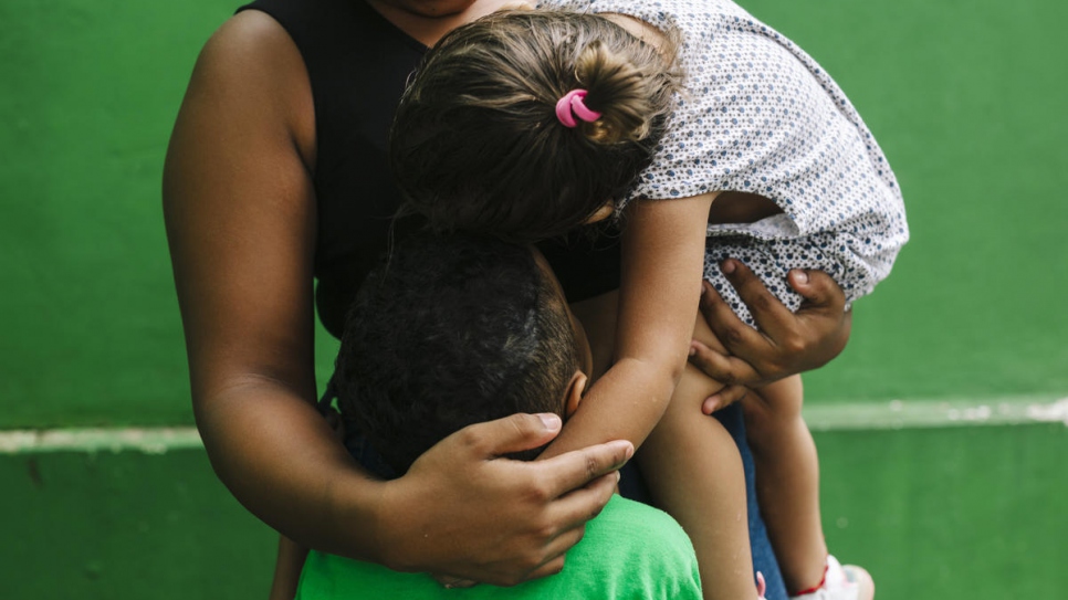 A mother embraces her children at a shelter for refugees and asylum-seekers in Tapachula, Mexico.