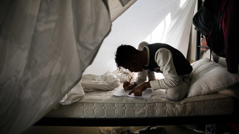 Unaccompanied boys from Afghanistan and Syria live in shipping containers converted into shelters that accommodate up to 20 people at a time in Section A of the Moria reception centre.