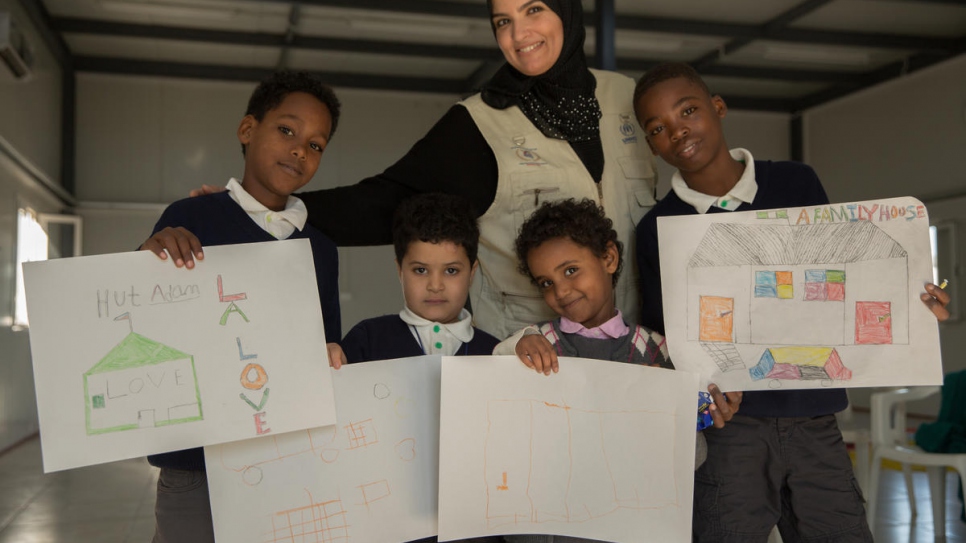 The children display their drawings at the end of one of the sessions.