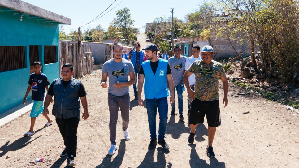 Youth Against Violence head Santiago Ávila shows Mexican actor Alfonso Herrera around a neighbourhood in the Honduran capital where the anti-gang organization is active, in March, 2020.