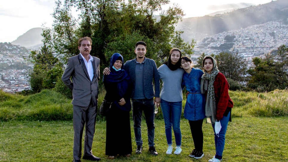 Zohra and her brother Hasibullah (both centre) revel in the Quito sunset, surrounded by additional members of their immediate family.