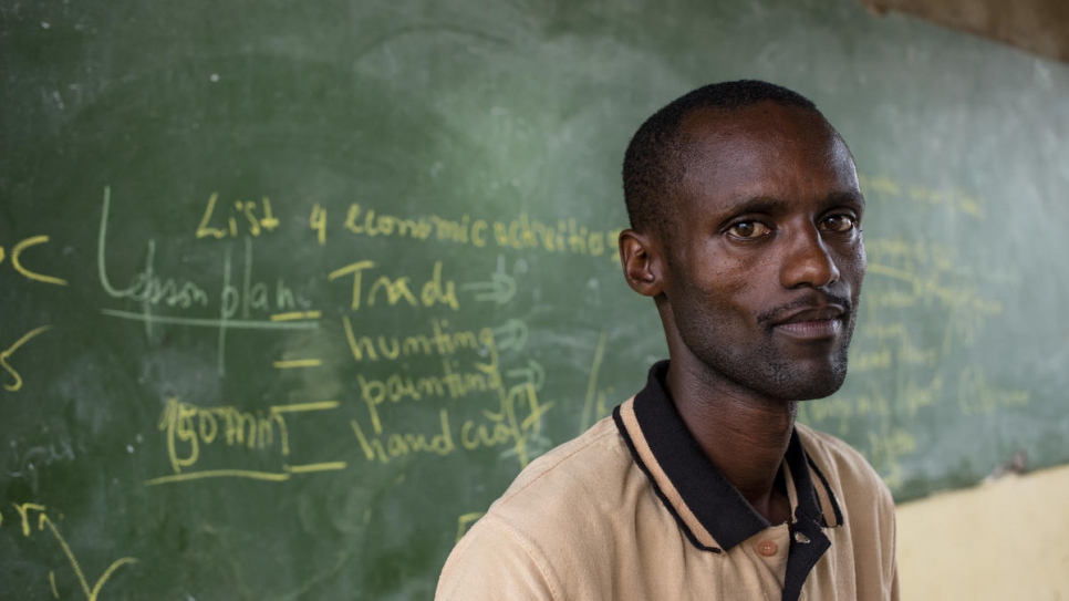 Burundian refugee and English teacher Moïse Ntariteka, sits in his classroom in the G.S. Paysannat school in Mahama refugee camp, Rwanda.
