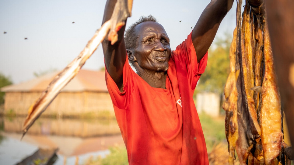 Kai, 80, now feeds his family and earns his living by catching fish, which he preserves by hanging them in the sun outside his home.