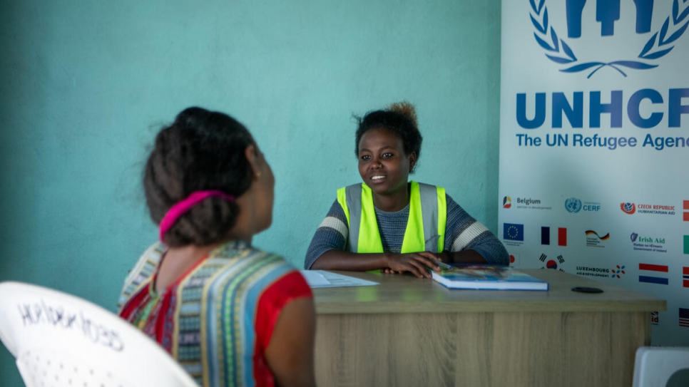 Huriya Musa counsels a refugee woman at a protection desk in Alemwach refugee site. UNHCR works with partners to ensure refugees have access to psychosocial support.
