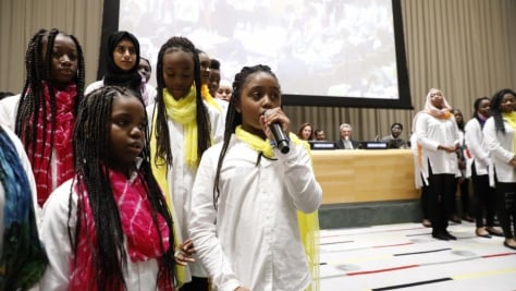 United States. The Global Compact on Refugees is approved by the UN General Assembly at the United Nations Headquarters in New York. The moment was commemorated with a special event including *senior* leaders from the UN, alongside refugees and a choir of young refugees and migrants.