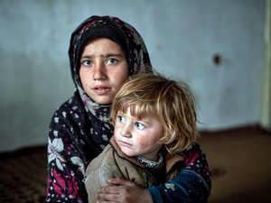 Nine-year-old Fauzia* and her three-year-old sister Aseela* in their temporary accommodation in Kabul. *Names have been changed.