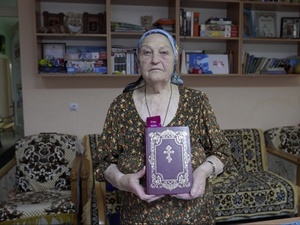 Woman holding the Bible