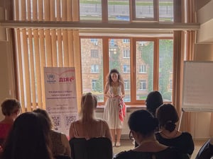 A woman is making a speech during the event