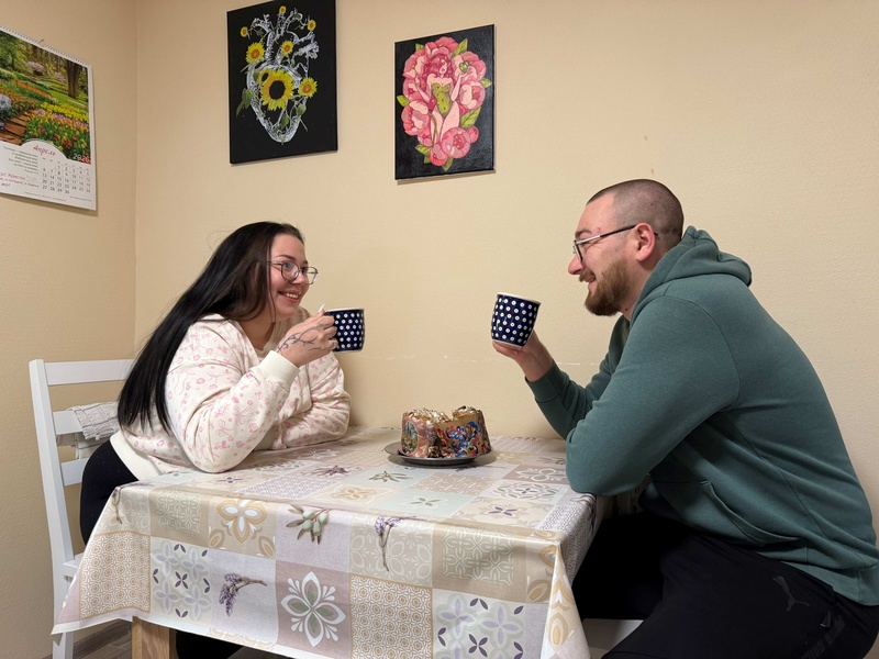 Artem and Sofiia sitting at the table 