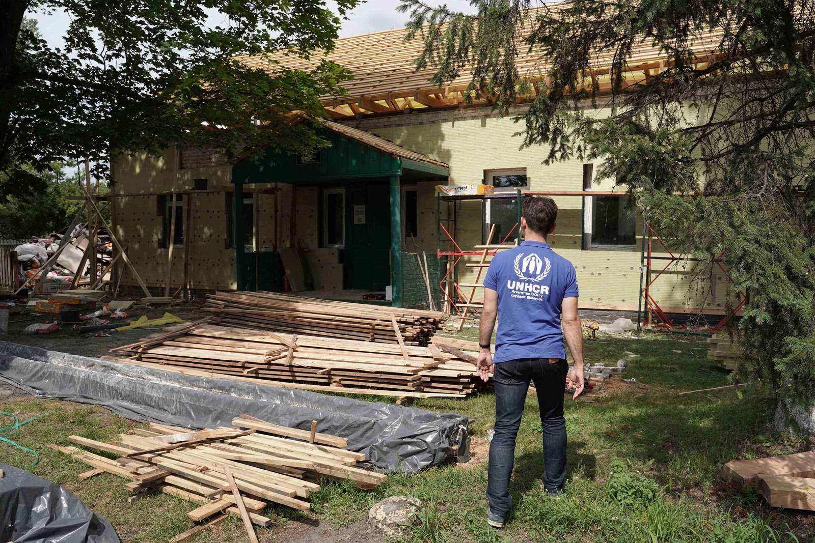 Man in front of the building under the reconstruction