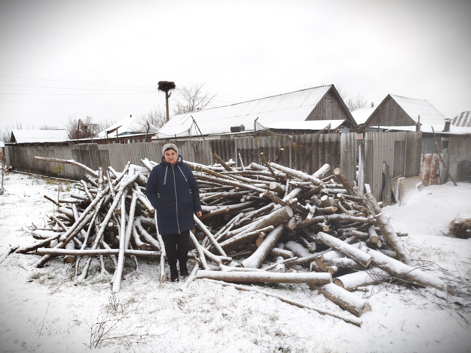Valentyna bought wood using UNHCR's cash assistance 