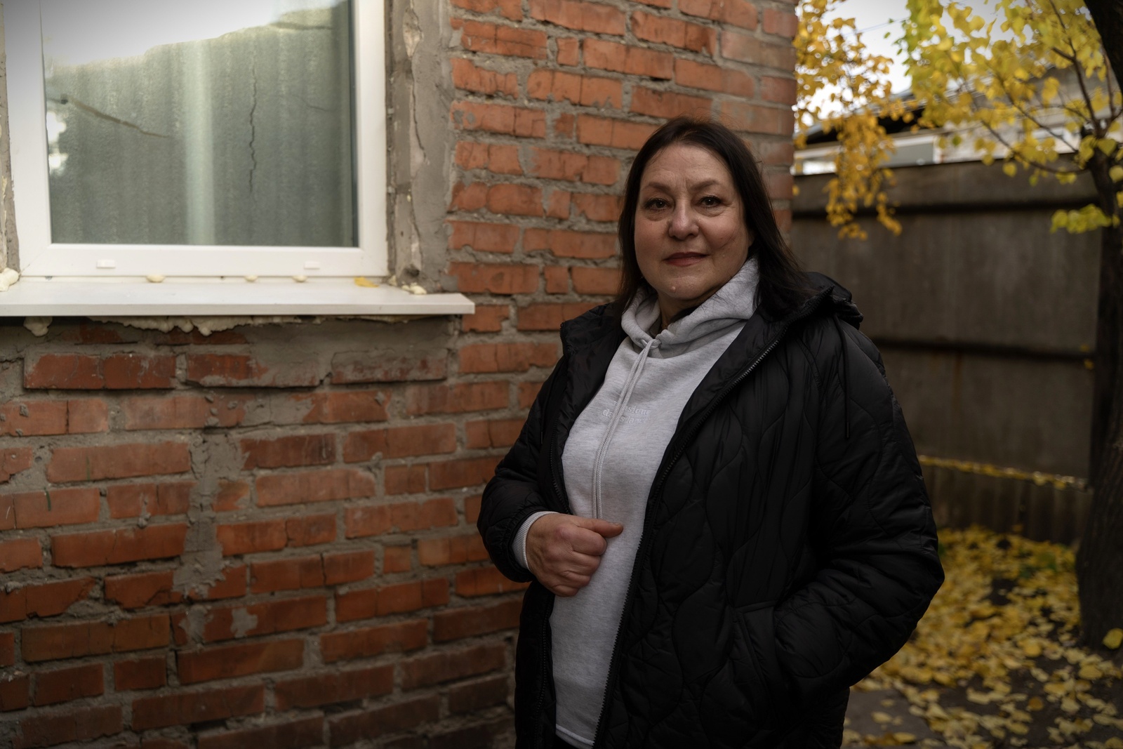 Larysa near her house in Kharkiv 