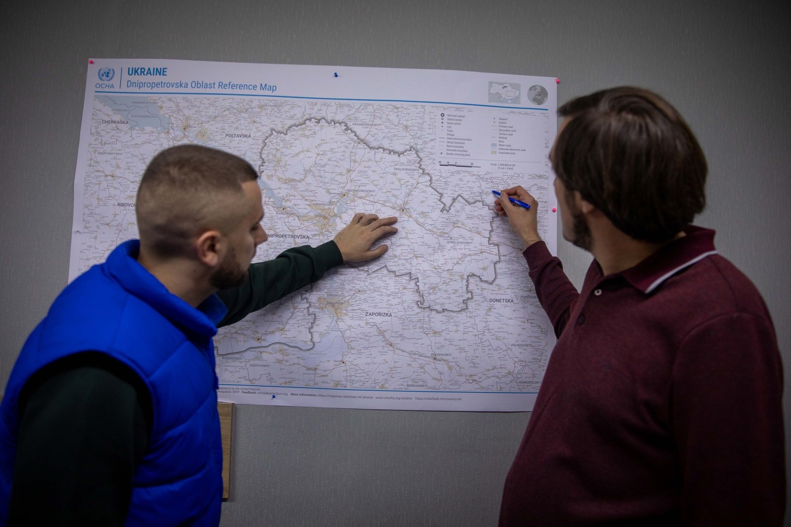 Proliska staff planning the evacuation route for their vehicle going on an evacuation mission in communities near the front lines.