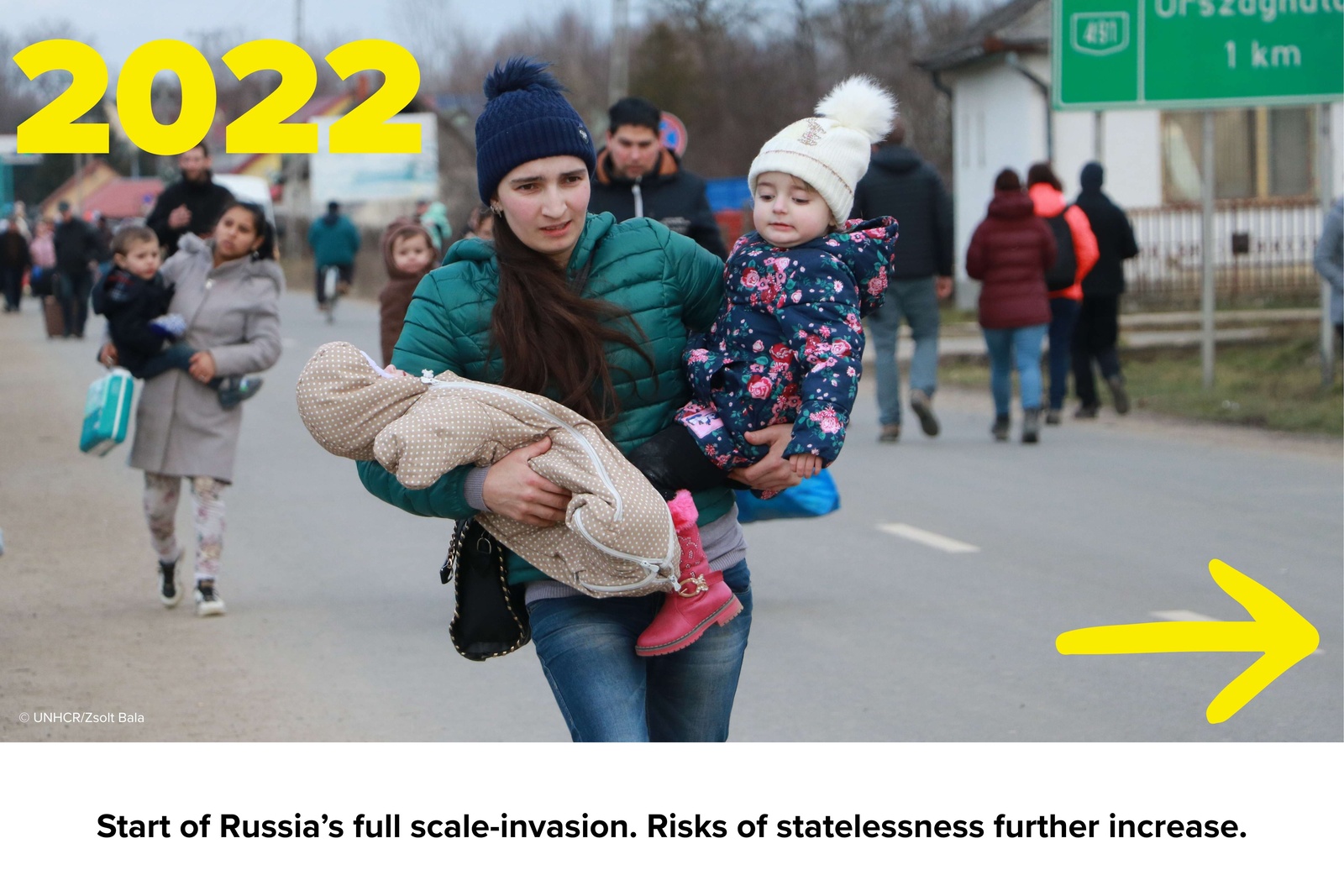 Woman with two kids crossing the border.