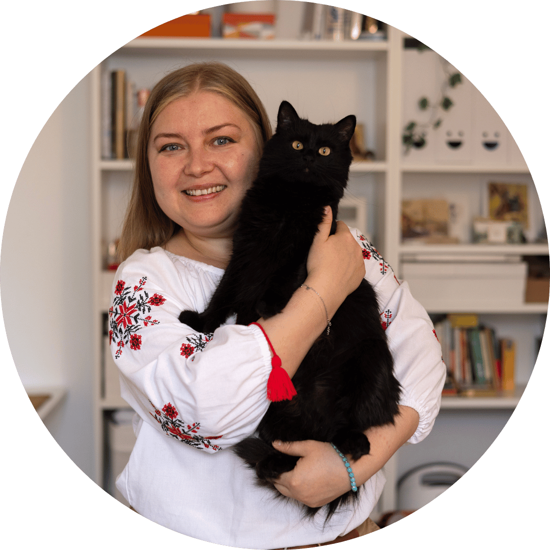 A Ukrainian woman poses with her cat
