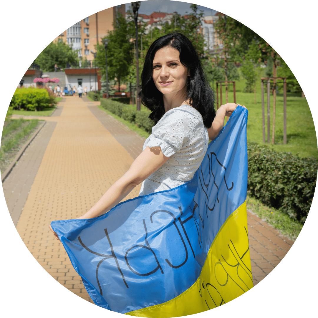 A woman in Ukraine posing with a flag