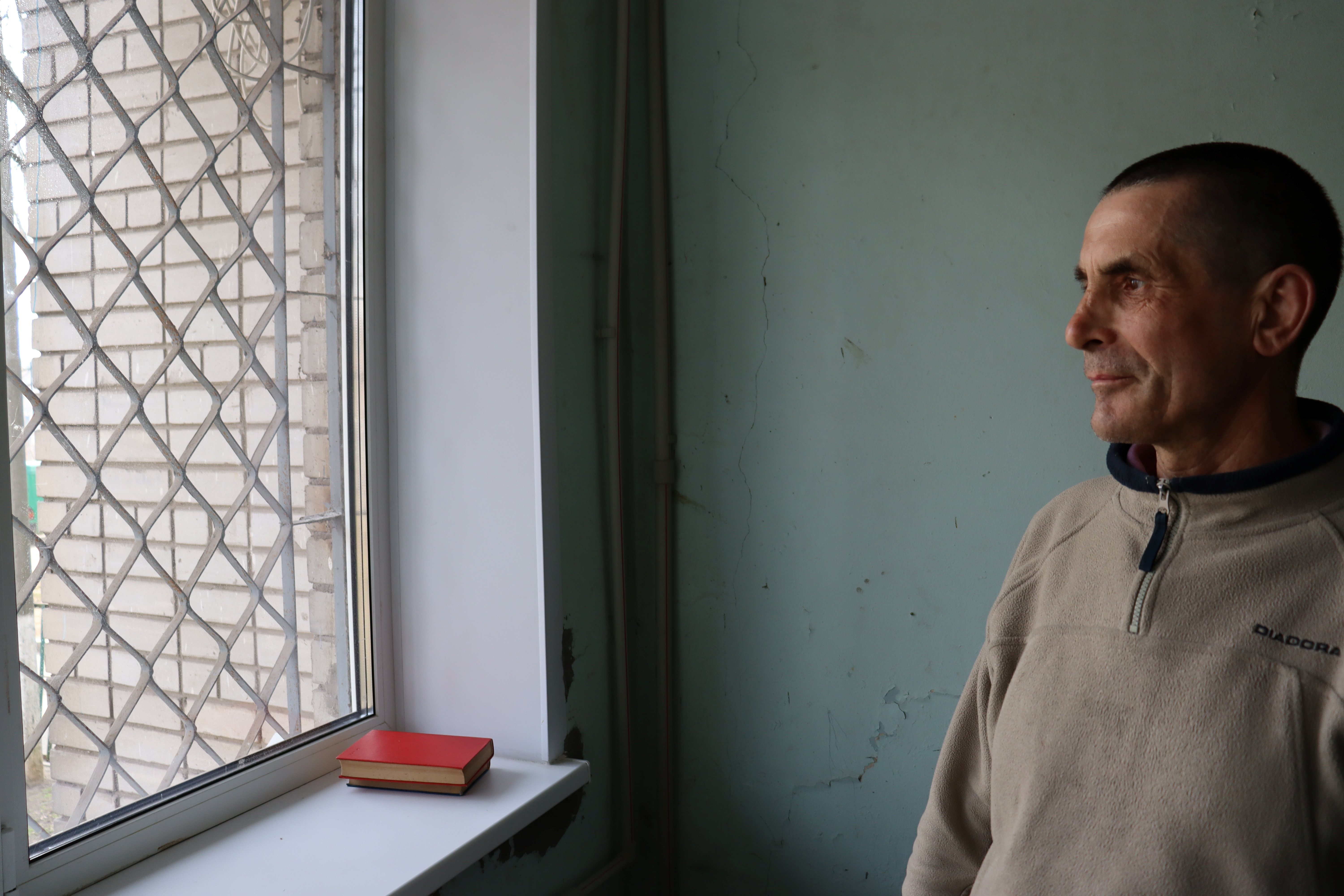 Man is looking through the window