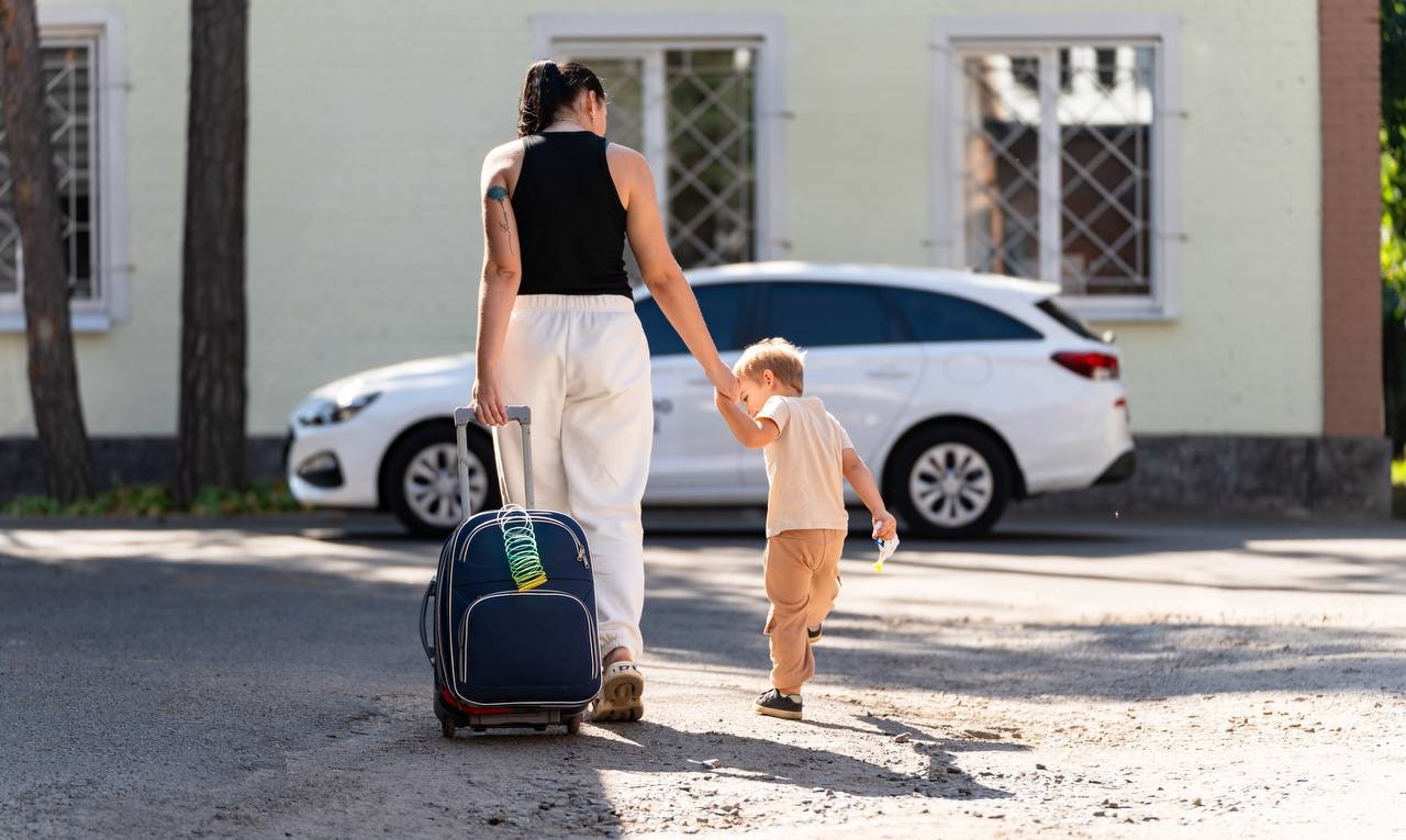 Woman is walking with a kid