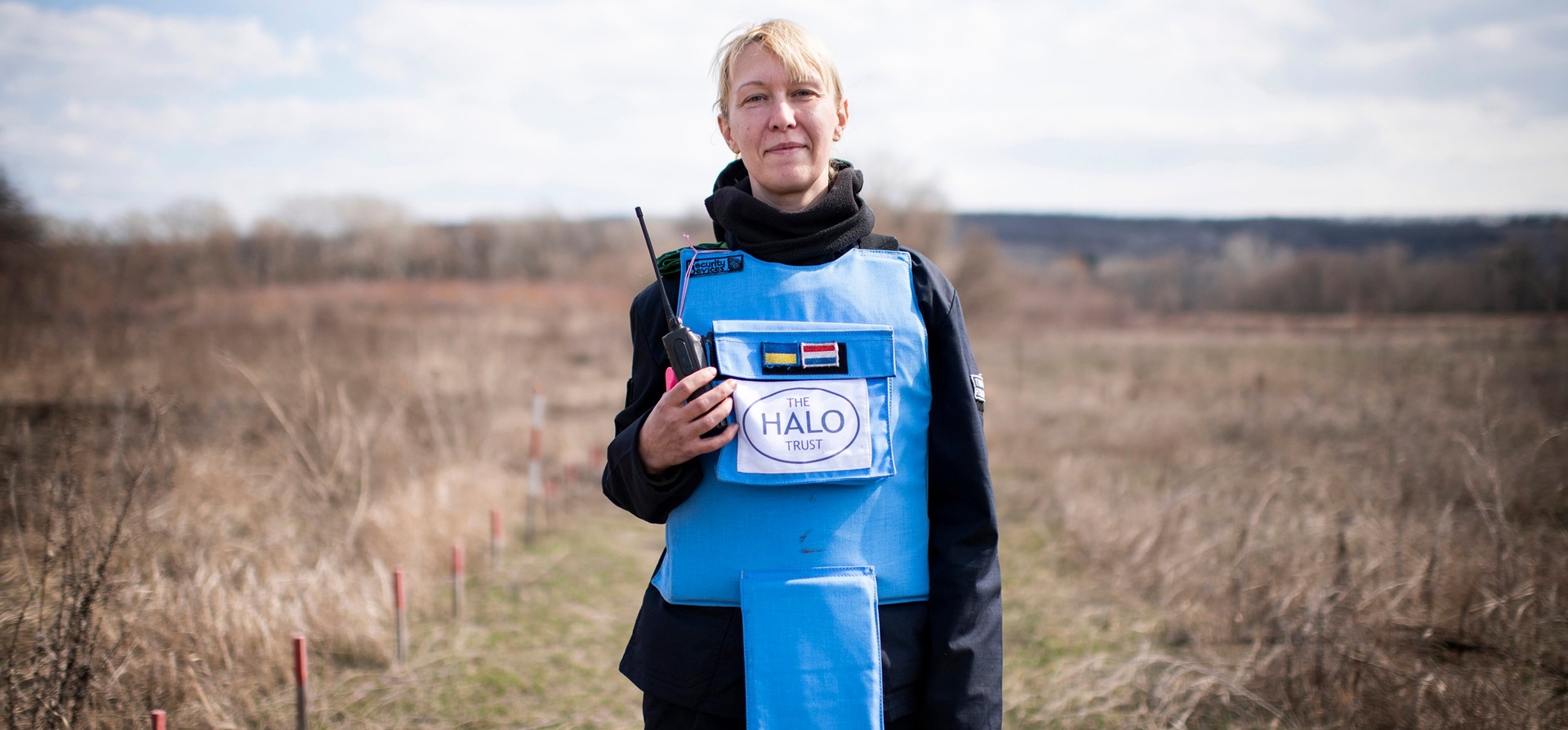 Ukraine. A female deminer in partially cleared minefield in the Donbas area