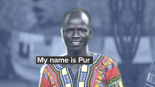 Yiech Pur Biel smiles at the camera. Text reads "My name is Pur".