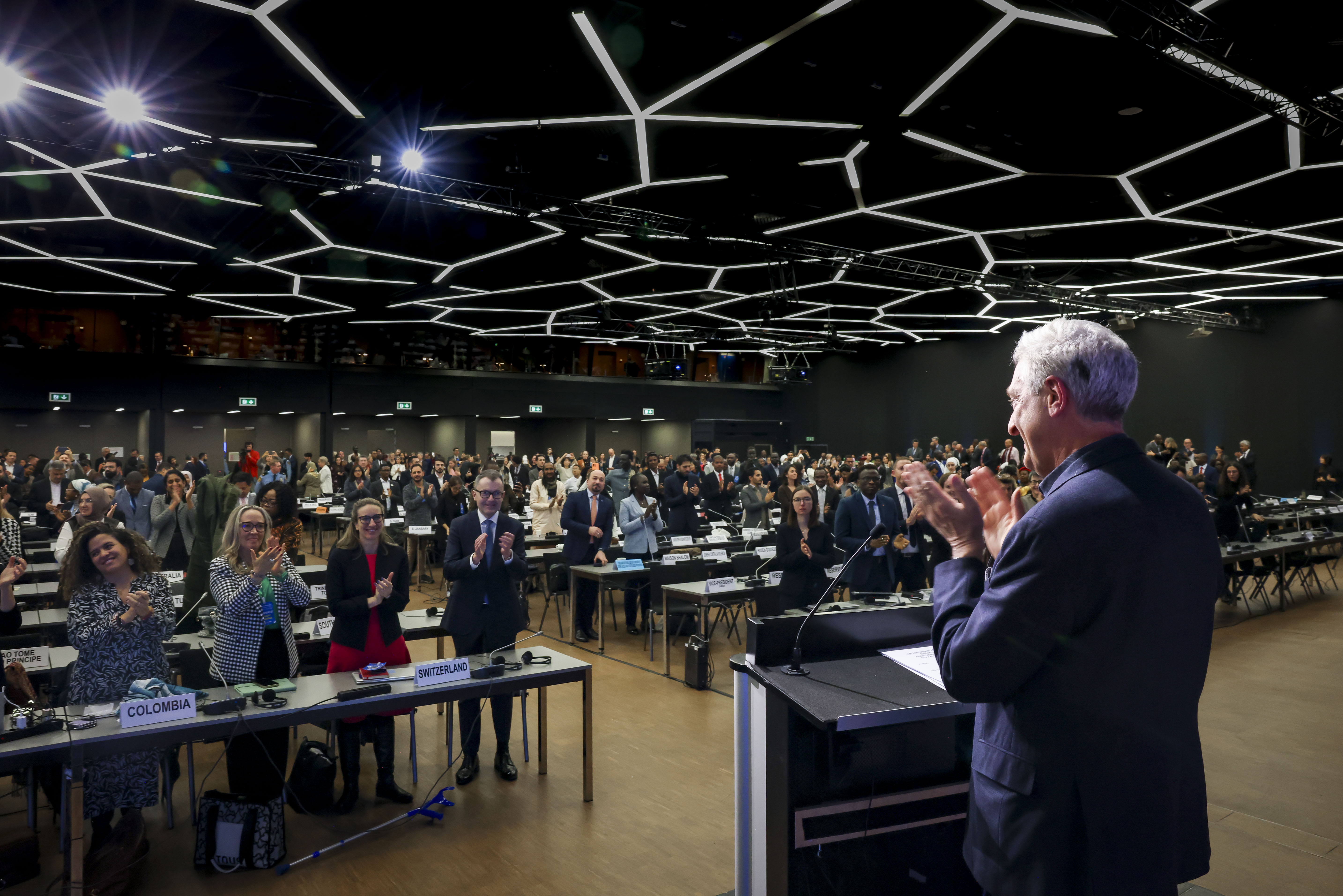 UN High Commissioner for Refugees, Filippo Grandi, stands and applauds during the closing session of the Global Refugee Forum.