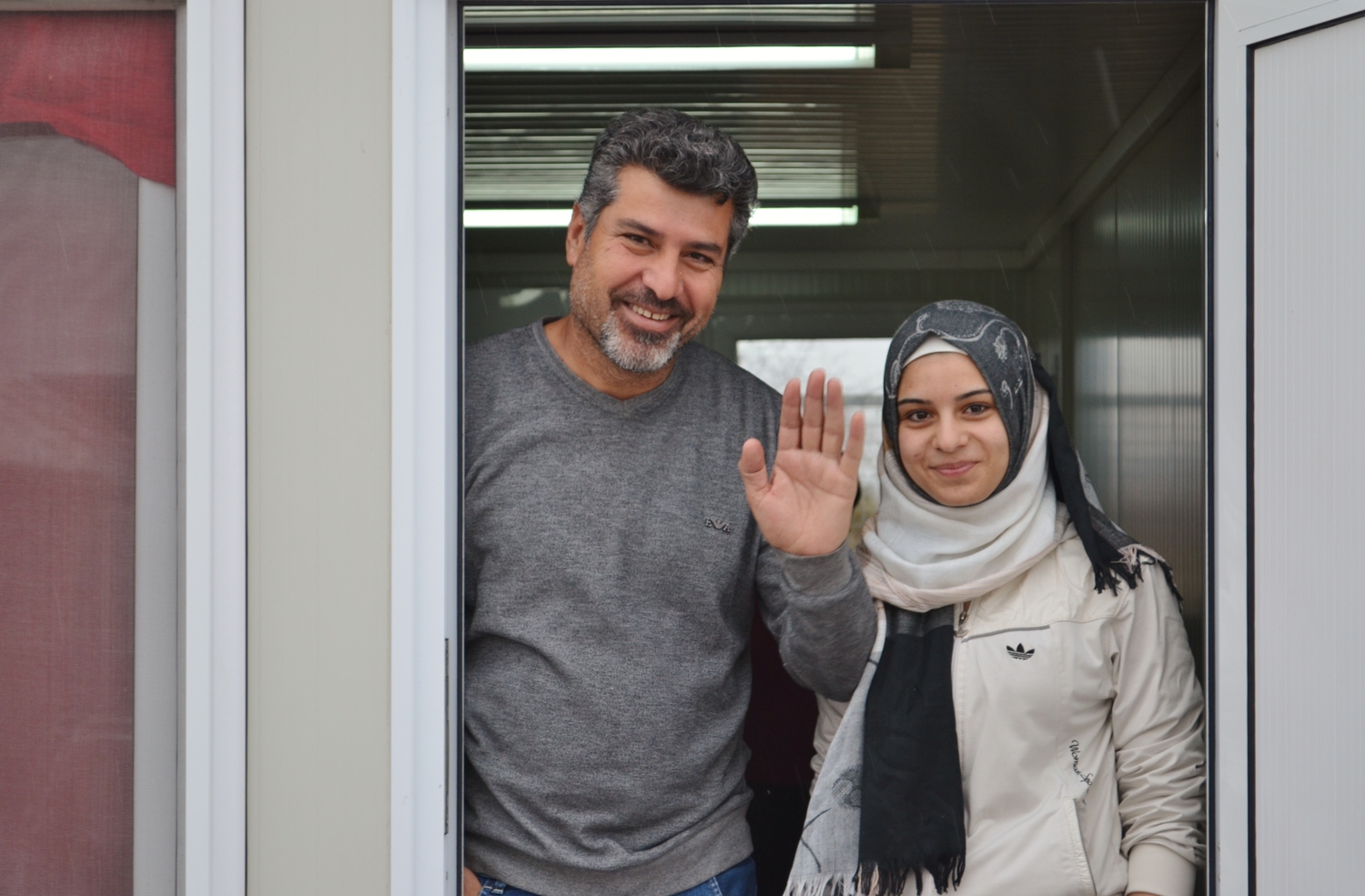 Former Yugoslav Republic of Macedonia. Syrian refugee Shergo and his daughter Avin with a rare smile on their faces