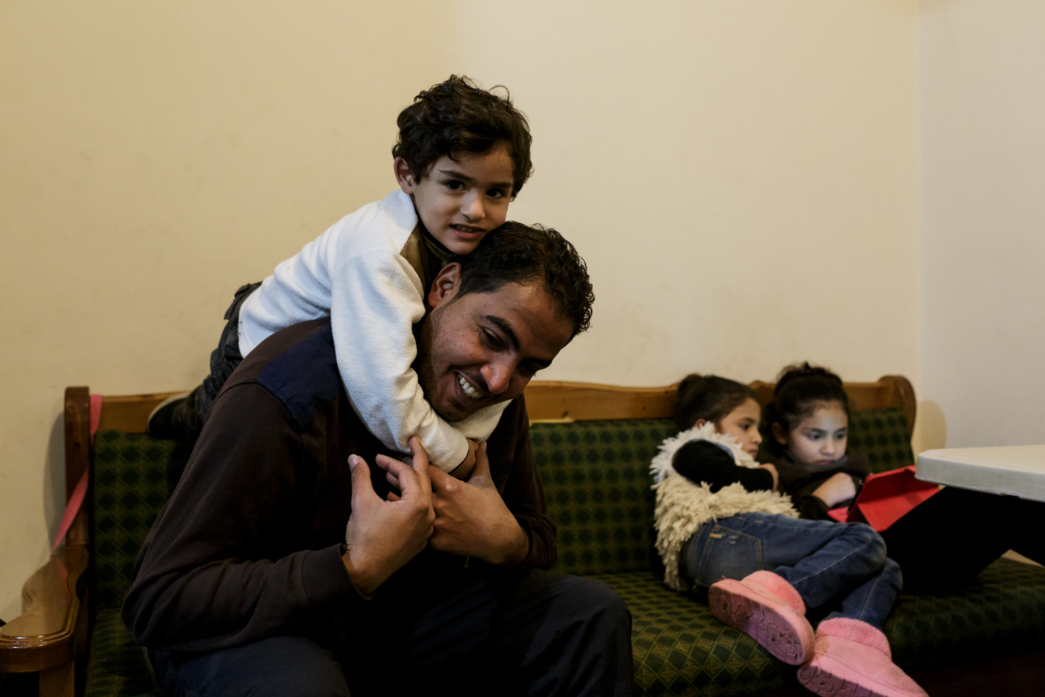 Greece. The Syrian electrician installing power at Lesbos refugee camp