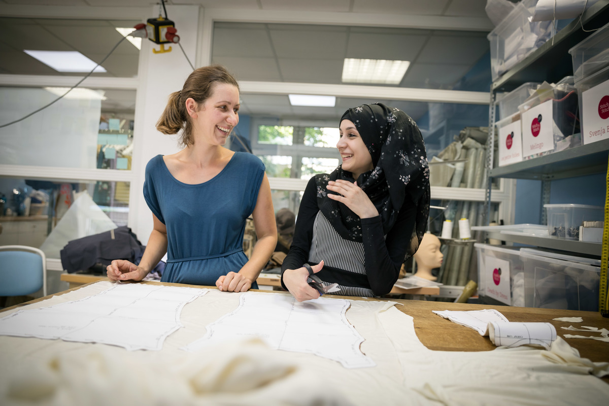 Germany. Refugee women got a job as a seamstress in a Frankfurt fashion workshop.