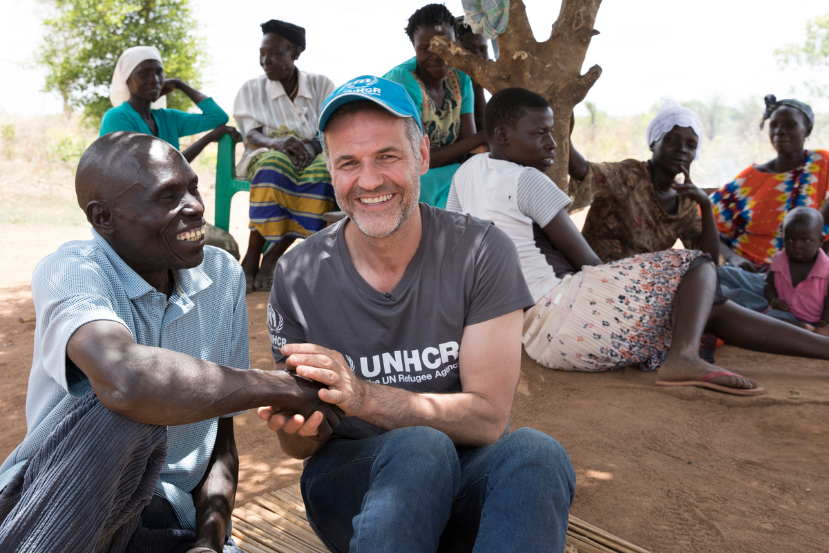 Uganda. UNHCR Goodwill Ambassador Khaled Hosseini with Yahaya and Mike at Bidibidi settlement