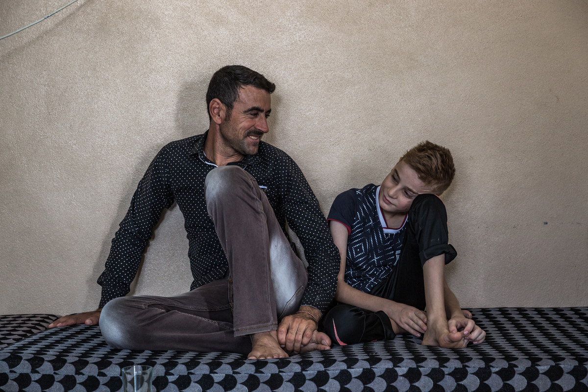 Iraq. Yazidi child gets ready to reunite with his mother in Canada
