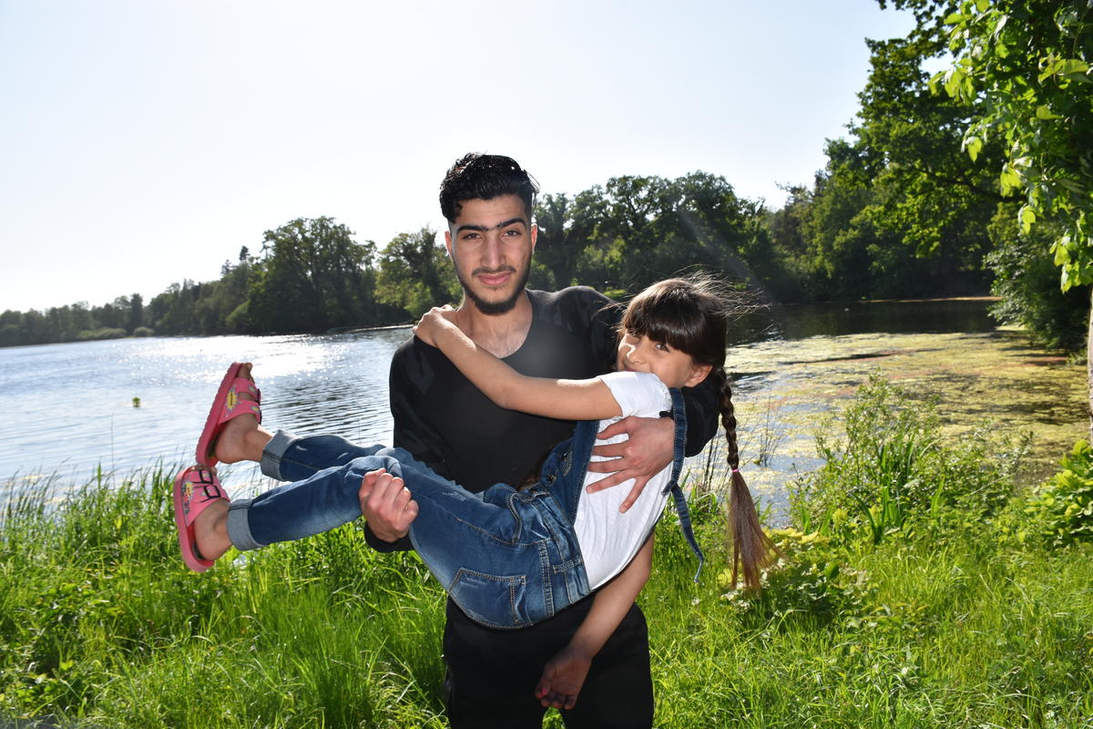 Refugee from Syria hugs his sister in Lensahn, northern Germany