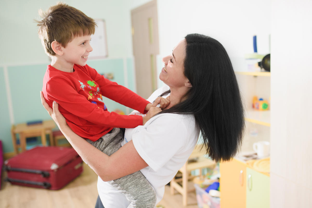 Olena Abayeva plays with her son Vlad in the centre for children with mental disorders opened by Olena in Sumy with support from UNHCR