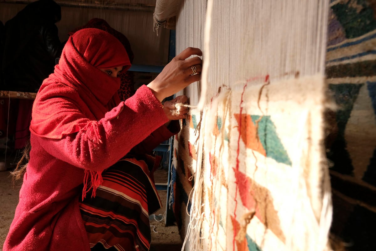 Afghanistan. Women participate in weaving project as part of UNHCR's community based protection measures in Mazaar