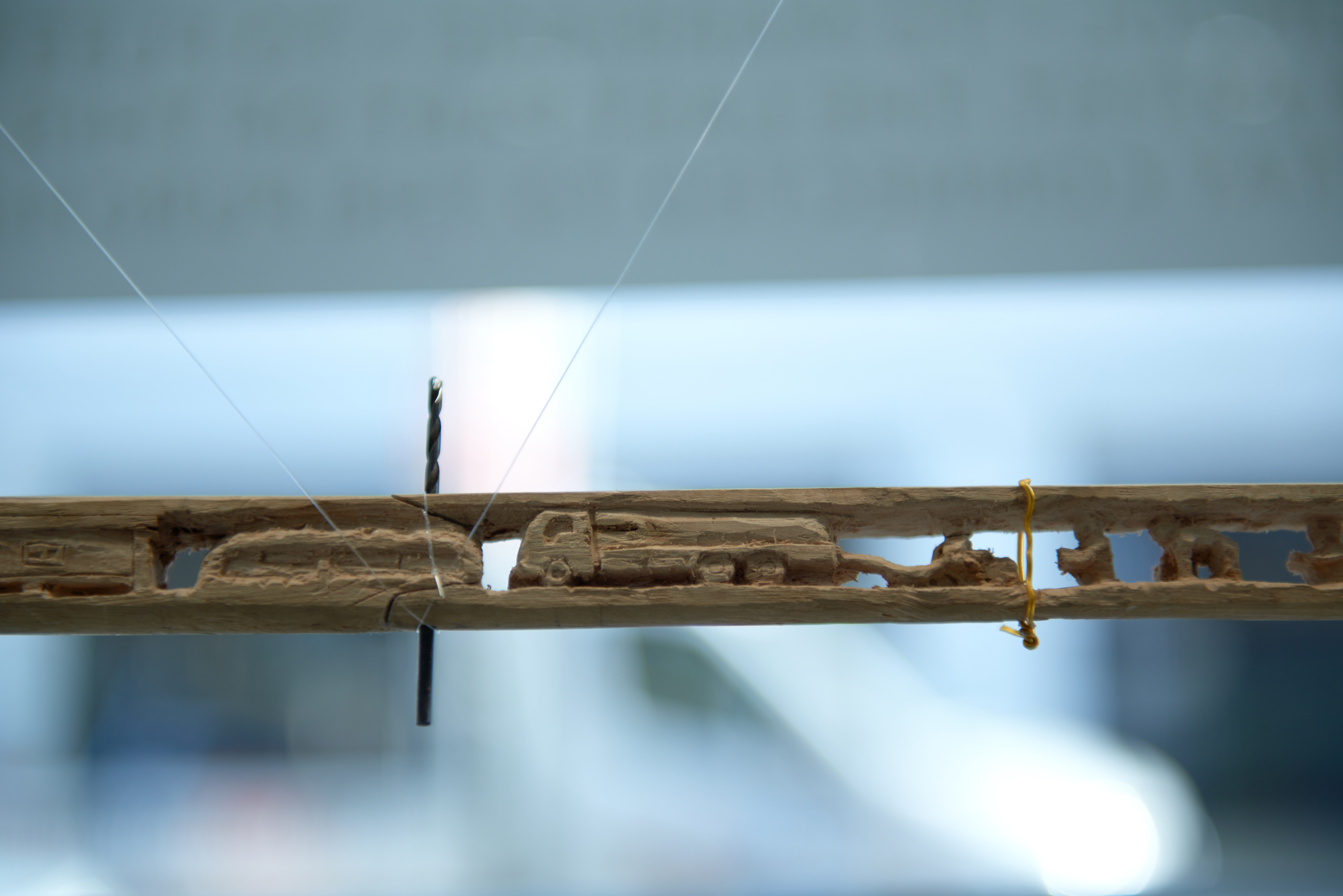 This broomstick, carved by Tarek Mohamed Hamden, tells the story of his life. In 2012 Tarek and his family fled Syria and arrived in Za'atari Camp.