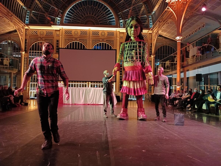 Little Amal was welcomed across the UK, and greeted with warmth and compassion. At an evening at the Royal Opera House she was helped to sleep by actors, singers and dancers.