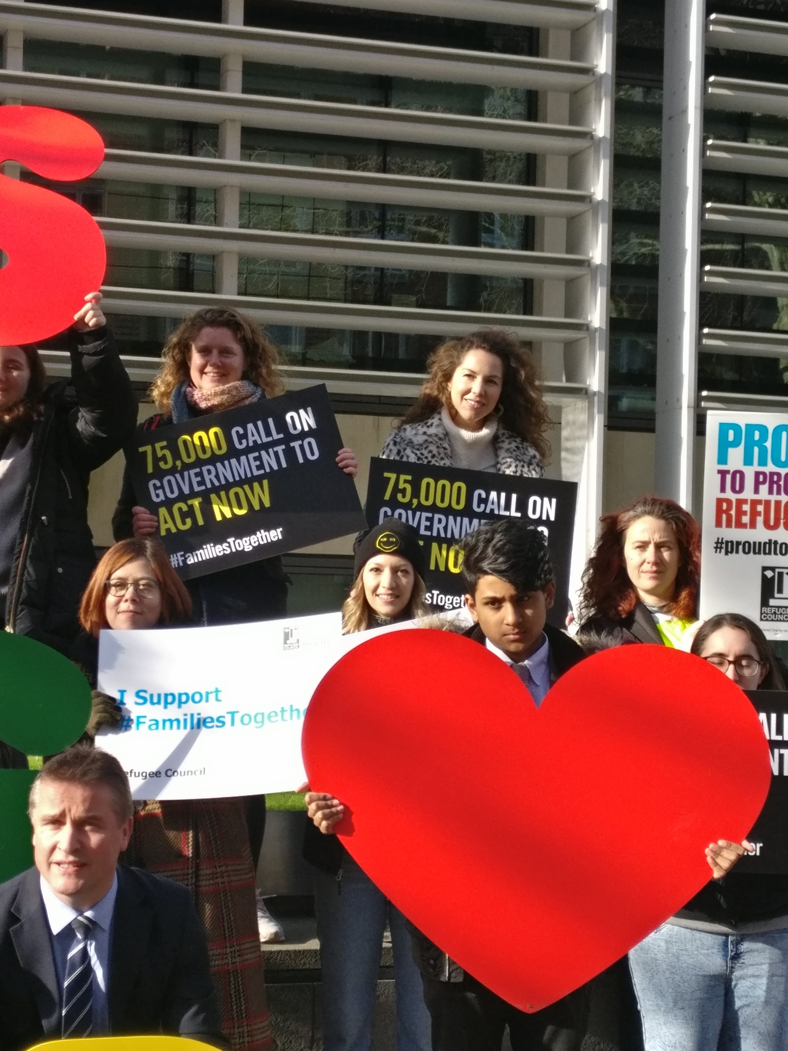 Campaigners and students gather outside the Home Office in London