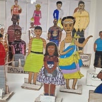 Portraits painted on paper and cut out card board figures 