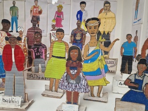 Portraits painted on paper and cut out card board figures 