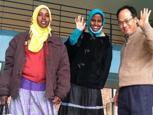 Nasra (left in yellow scarf) with fellow refugee Farah and a teacher at a language school in Iksan, South Korea.