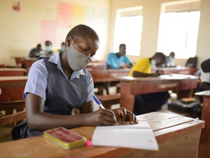 A South Sudanese refugee student attends primary school in a refugee settlement in Uganda.