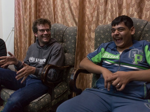 Jordan. UNHCR High Profile Supporter John Green meets Syrian refugee Abu Mustafa and his family