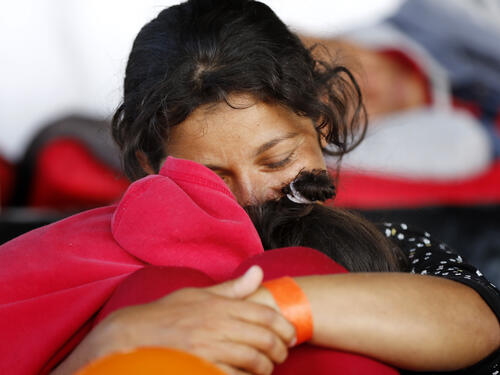 Young children from the Sahrawi community play on the sand dunes at Dakhla camp in Tindouf, western Algeria, close to the border with Morocco and Western Sahara.