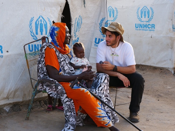Omar interviewing a Sudanese refugee