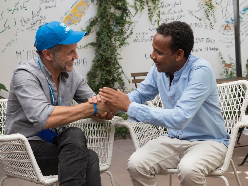 Italy. UNHCR Goodwill Ambassador Khaled Hosseini visits the refugee run restaurant, “Orient Experience”