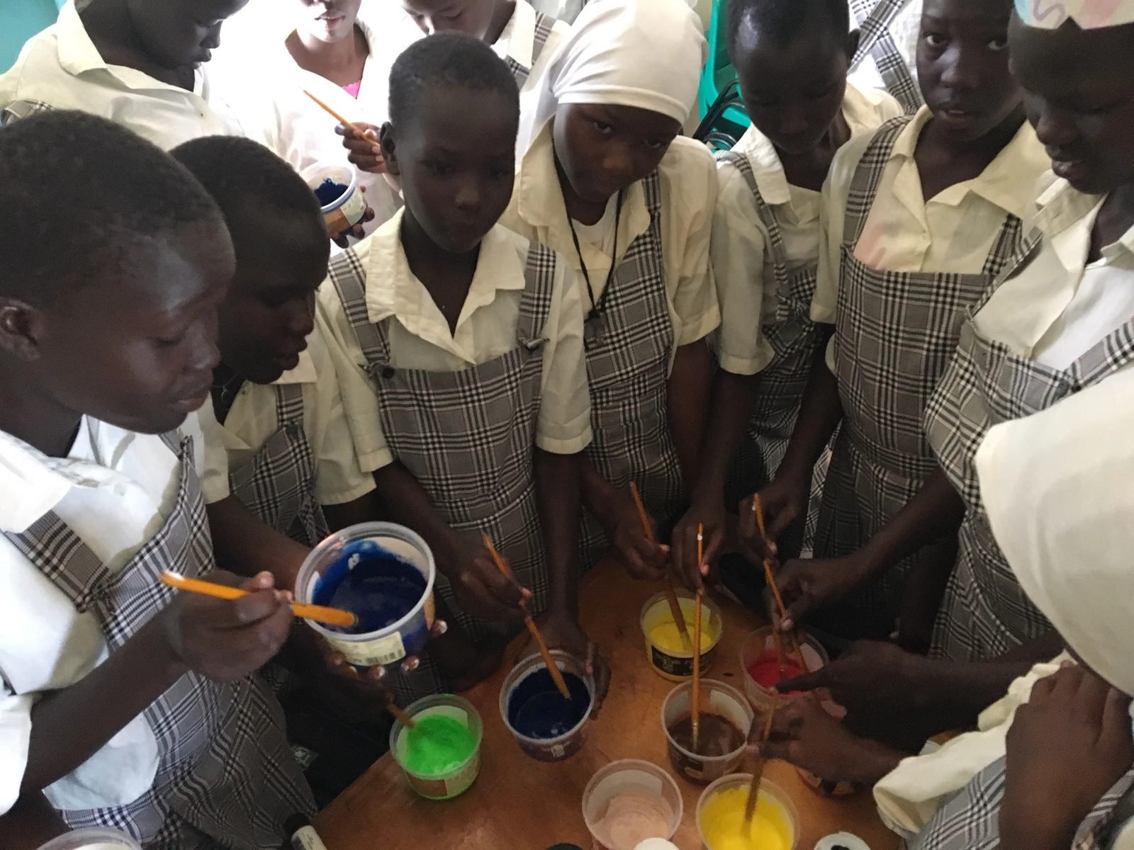 A group of young women with paint