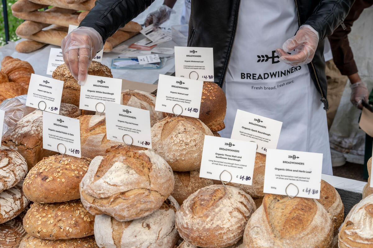 Different types of bread at a market stall.