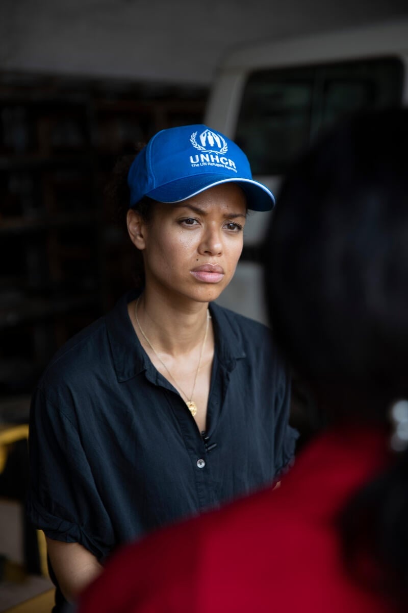 Gugu Mbatha-Raw wearing a UNHCR blue cap.